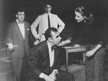 Harry Stewart, Neill Briggs watch as Margaret Joslin addresses Bill Burton in The Fifth Season (1955-1956)